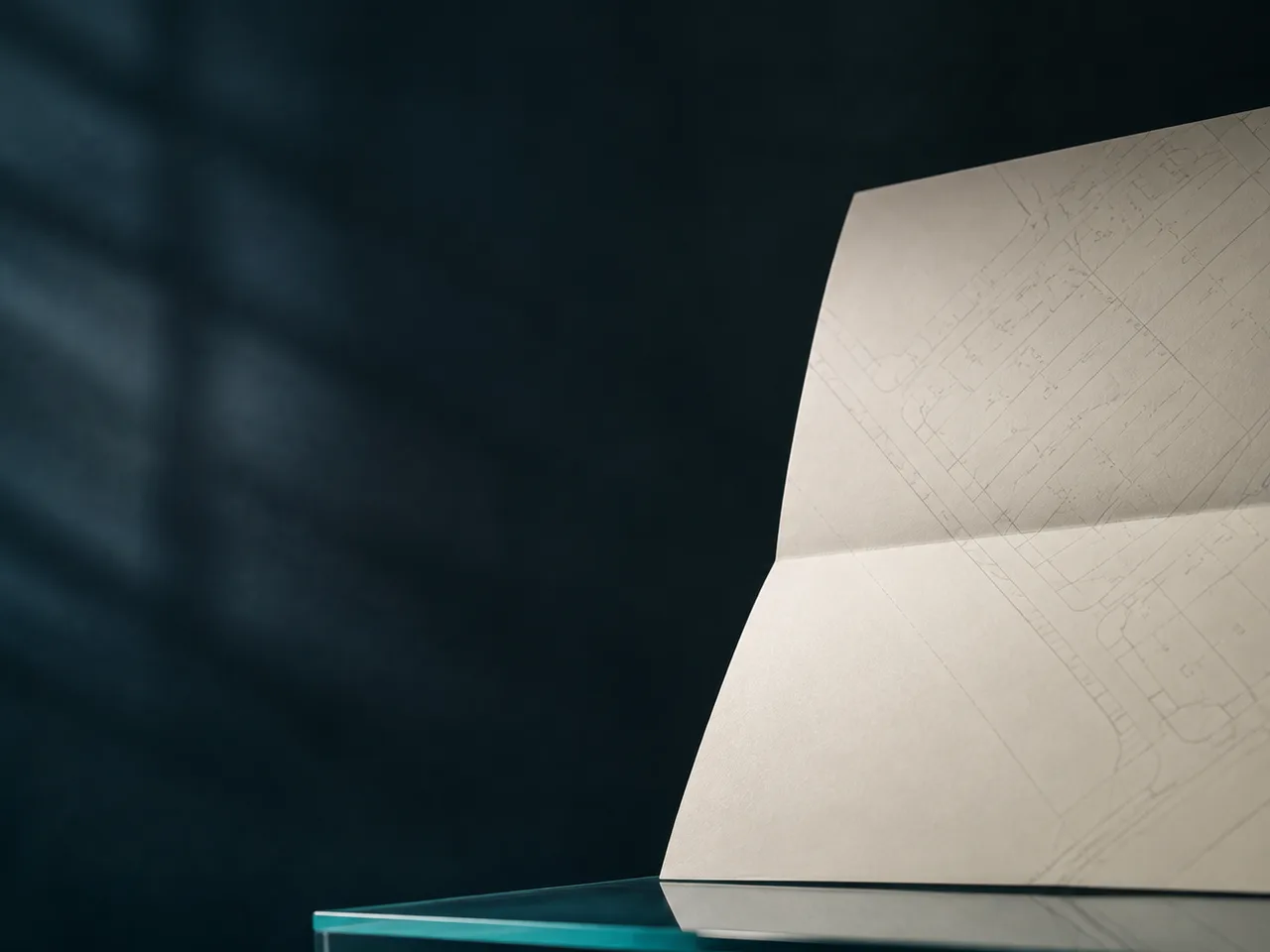 Folded property plan ready for a solicitor to examine